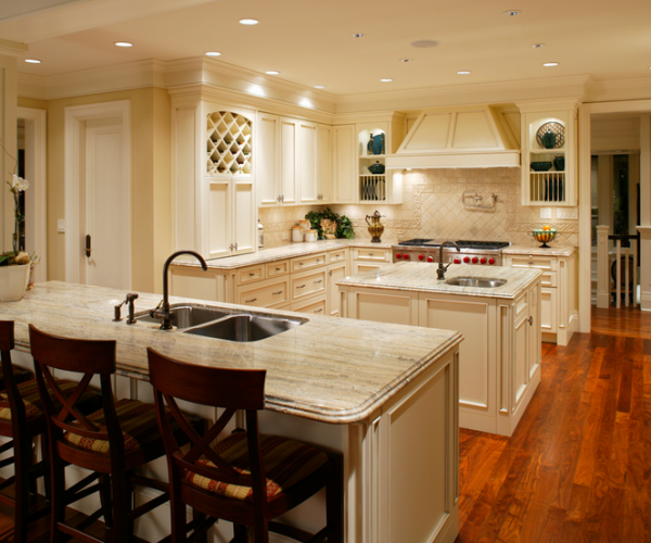 beautiful newly renovated kitchen with a bar an island wine rack and hardwood floors