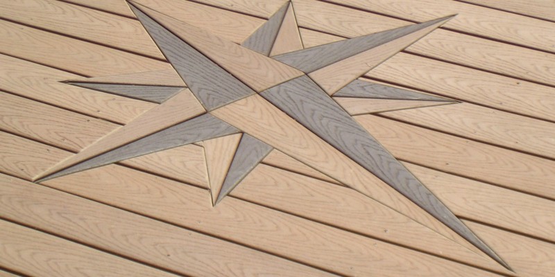 intricately embedded compass design in custom deck floor